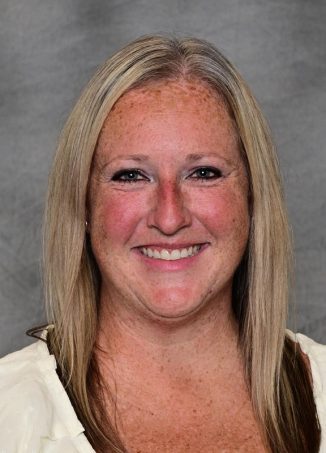 Professional headshot of smiling woman with blonde hair.
