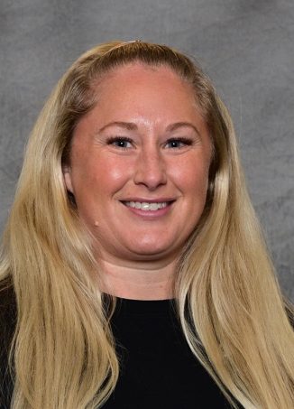 Professional headshot of smiling woman with long blonde hair.