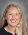 Professional headshot of smiling woman with long blonde hair.