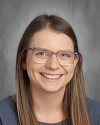 Woman wearing glasses and smiling for professional portrait