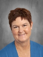 Woman with short brown hair, professional headshot